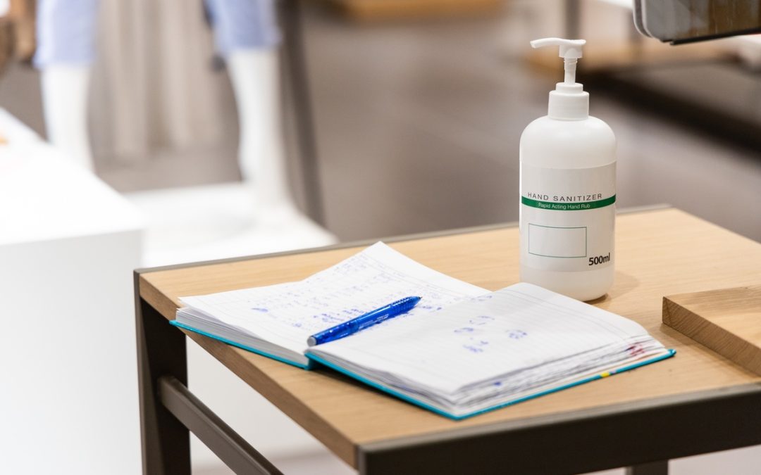 Hand sanitizer bottle on school desk