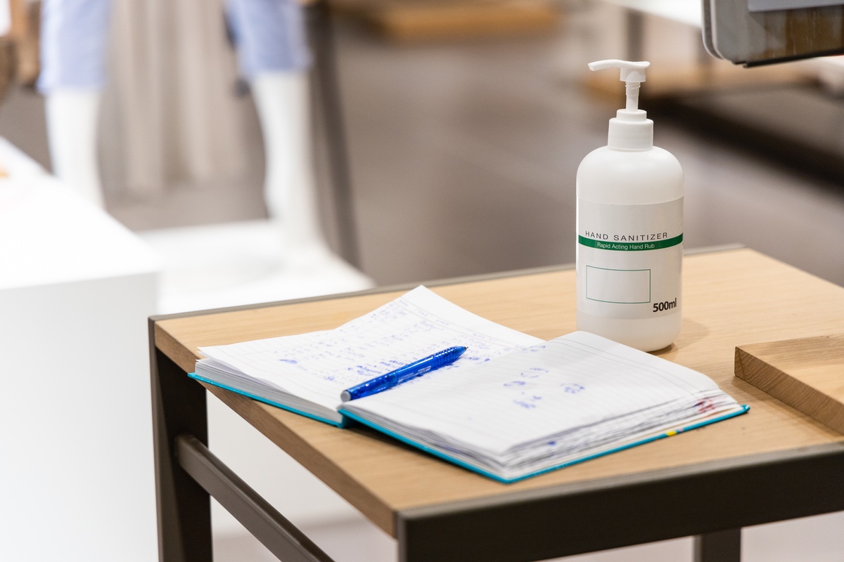 Hand sanitizer bottle on school desk