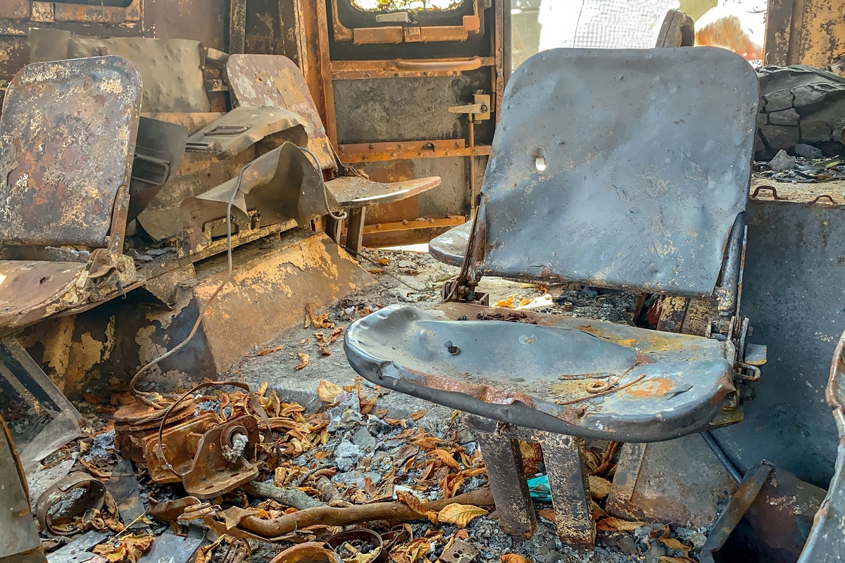 Commercial workplace after fire with melted office furniture visible